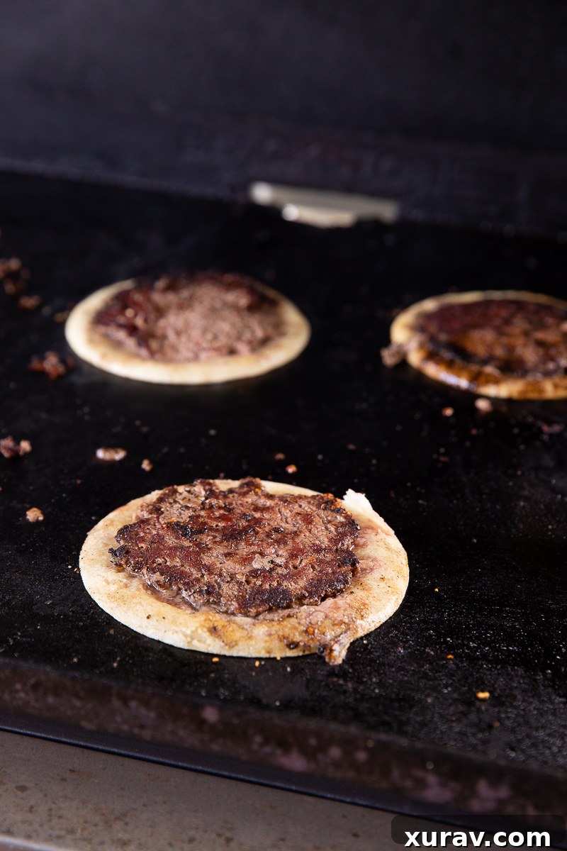 Smashburger tacos on the griddle. 
