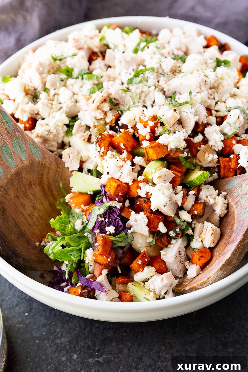 A hearty, flavor-packed salad with tender rotisserie chicken, roasted sweet potatoes, fresh greens, creamy feta, and a simple balsamic dressing. Perfect for an easy, nutritious meal.