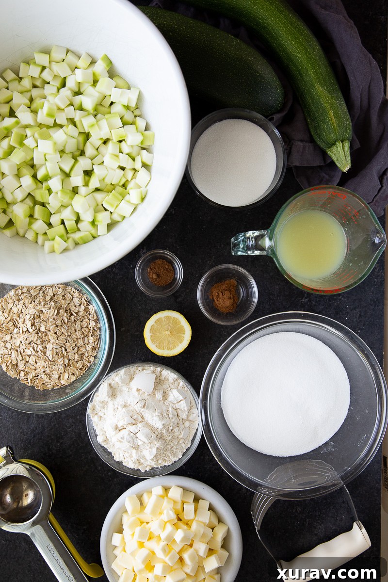 Made with diced zucchini, lemon juice, sugar, warm spices, and a buttery flour-based crumb topping, these simple ingredients come together to create a dessert that tastes just like classic apple crisp.