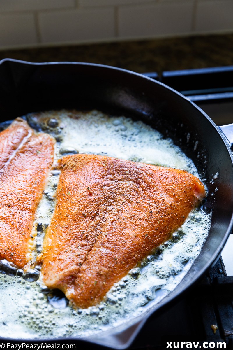 Cooking salmon for cajun salmon and shrimp in creamy cheese sauce