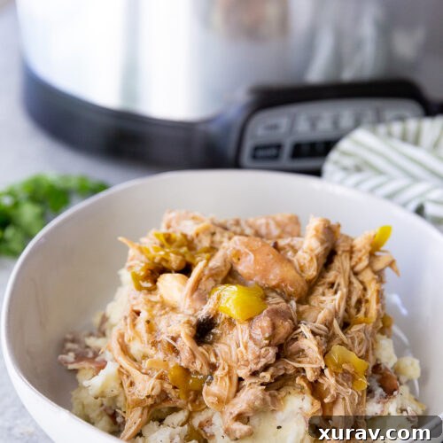 Slow cooker Mississippi Chicken over mashed potatoes