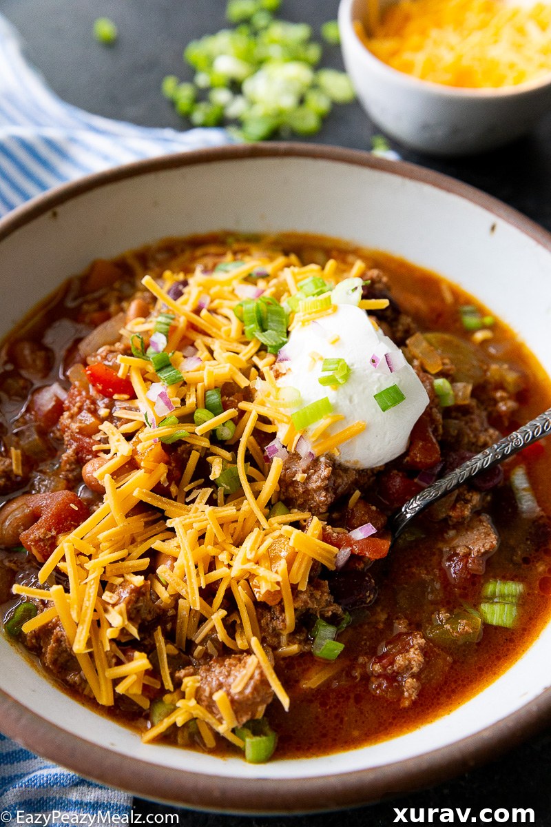 Slow Cooker Turkey Chili topped with amazing toppings, including sour cream, cilantro, and shredded cheese.