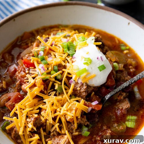Slow Cooker Turkey Chili topped with amazing toppings.