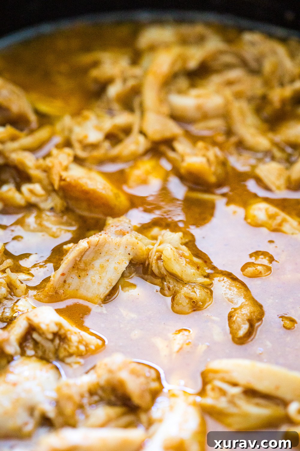 Slow Cooker Salsa Verde Chicken served in a tortilla