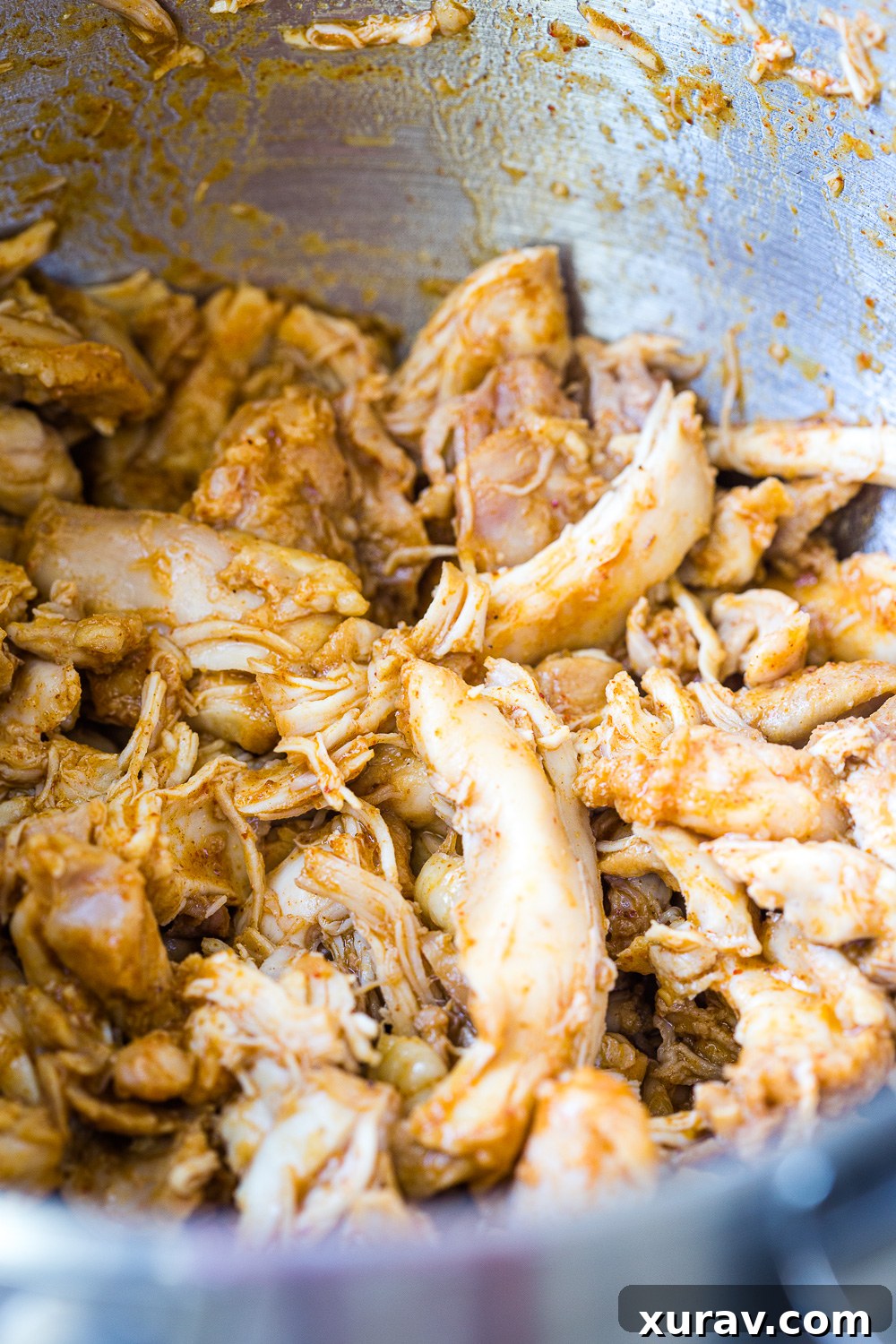 A bowl full of slow cooked salsa verde chicken with toppings