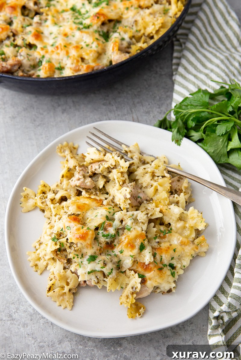 A plate of pesto chicken pasta bake, ready to be enjoyed.
