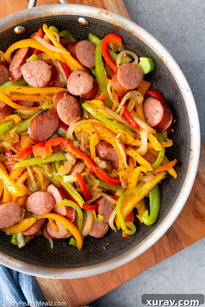 A skillet full of sausage and peppers