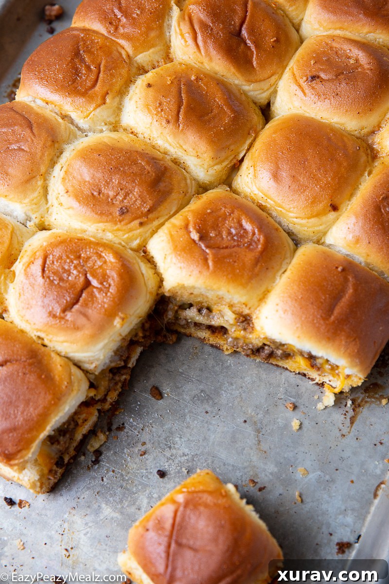 Beefy cheesy, taco sliders on a sheet pan