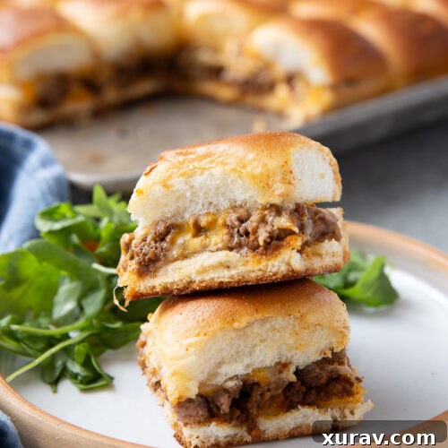 A plate with taco sliders, cheesy, beefy, and tasty.