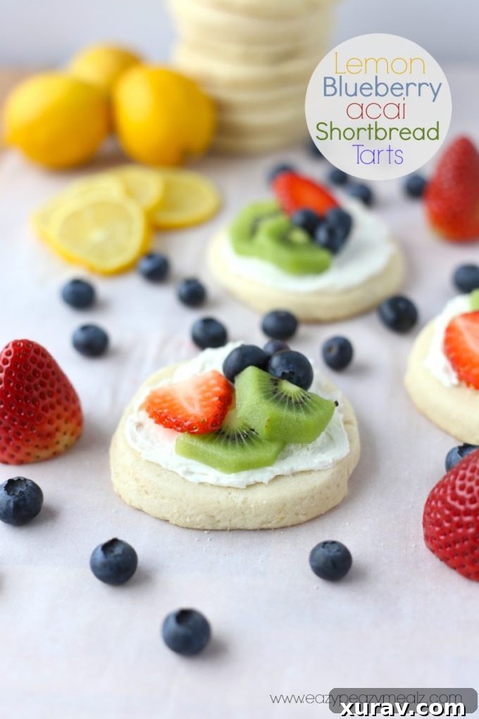 lemon blueberry acai shortbread tarts made with Truvia and Bigelow Tea, topped with fresh fruit