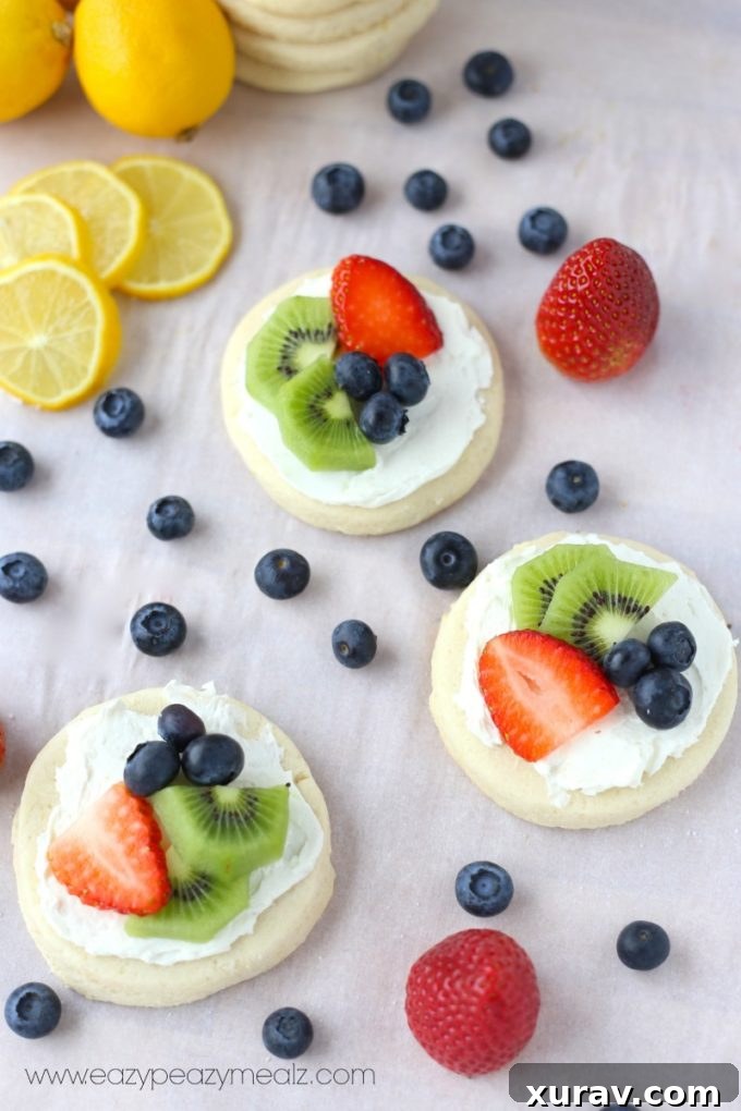 shortbread cookie tarts topped with fresh fruit and cream cheese frosting