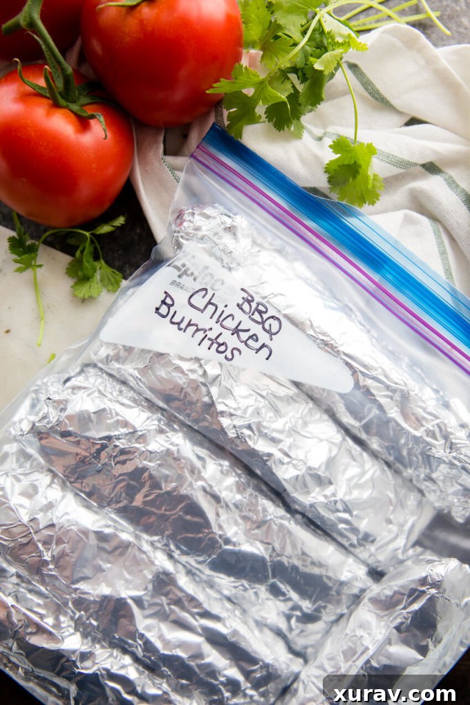 BBQ Chicken Burrito Recipe with shredded chicken, BBQ sauce, beans, corn, and cheese, ready for assembly.