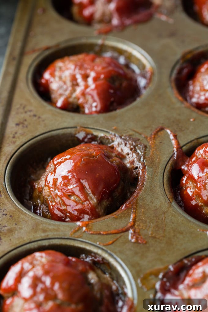 Individual Meatloaf Minis are packed with flavor, made in a muffin tin for thorough cooking and easy serving, and rivals any meatloaf out there!